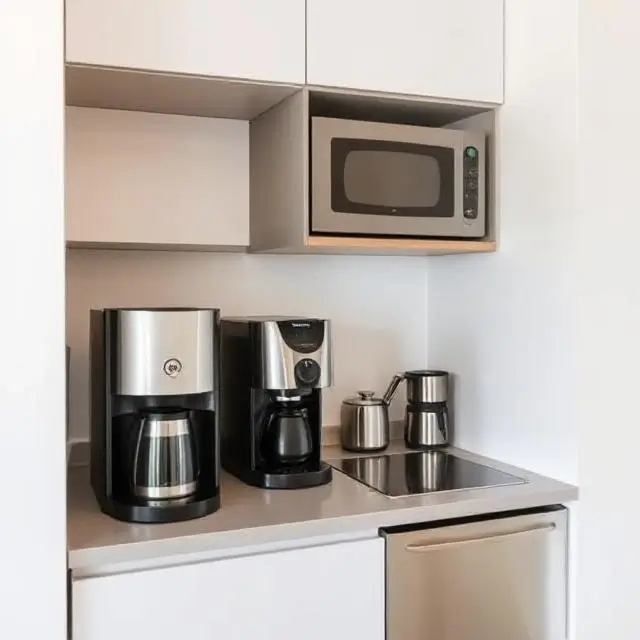 A modern kitchenette with a coffee machine.